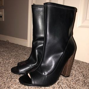 Black pair of leather open toed heels